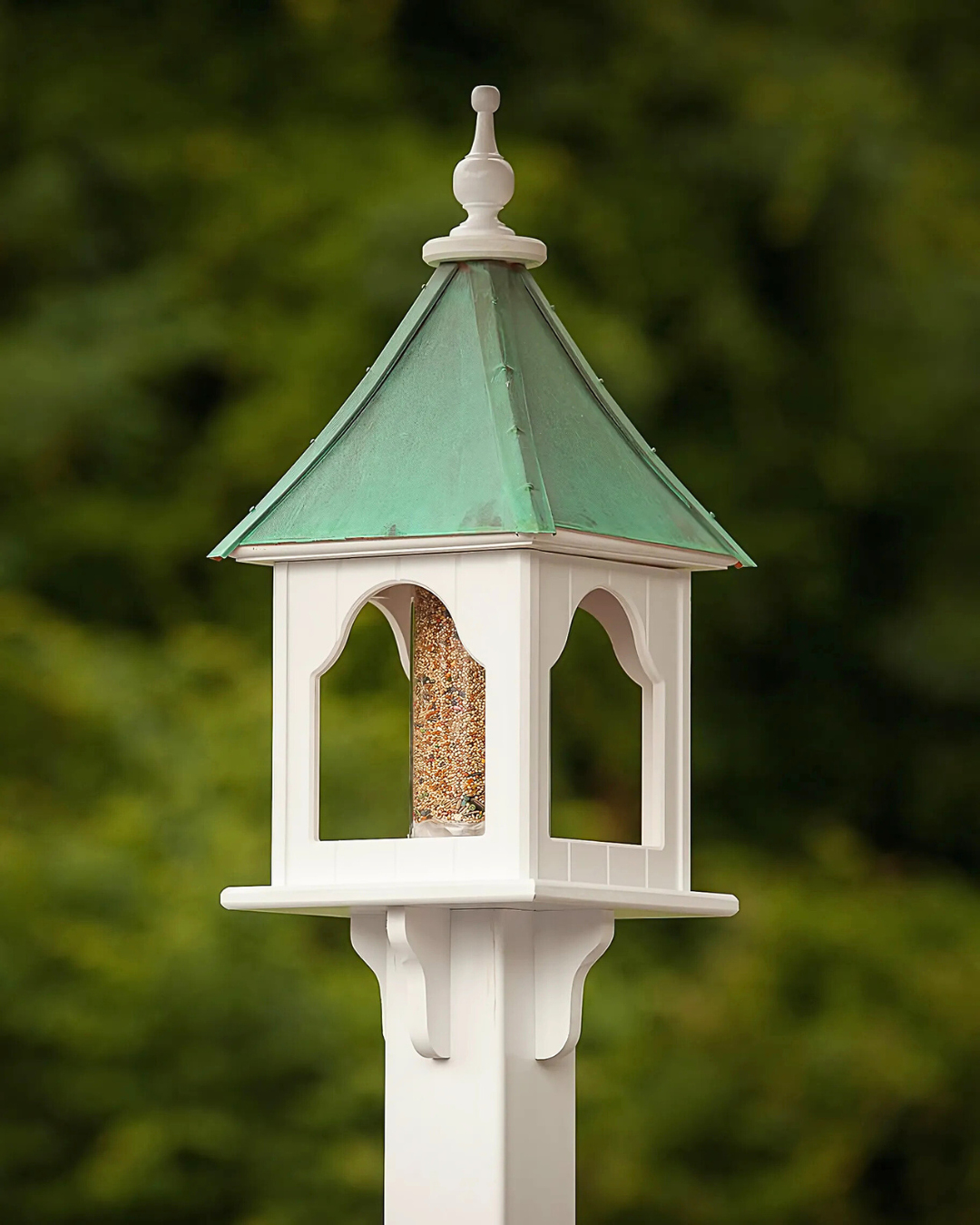 Handcrafted Unique Vinyl Bird Feeder with copper roof options, made from durable cellular expanded PVC. Features lift-off roof, heavy-duty acrylic tube (3" x 9"), and decorative brackets. Guaranteed maintenance-free with no rotting, cracking, or fading. USA-made, fits 4x4 post. Free shipping!