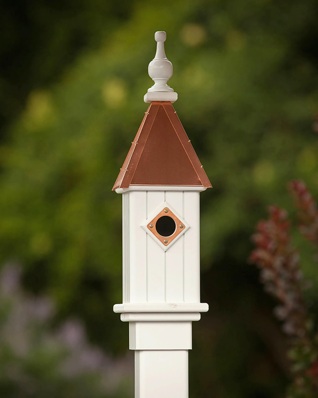 Copper Roof Bluebird House with predator guard, 1.5" entry hole, and lift-off roof for easy cleaning. Made of copper and vinyl, measures 20" tall x 6" wide, perfect for Eastern Bluebirds. USA made, maintenance-free, includes free shipping