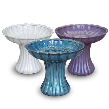 Elegant ceramic bird bath with pedestal design for attracting birds