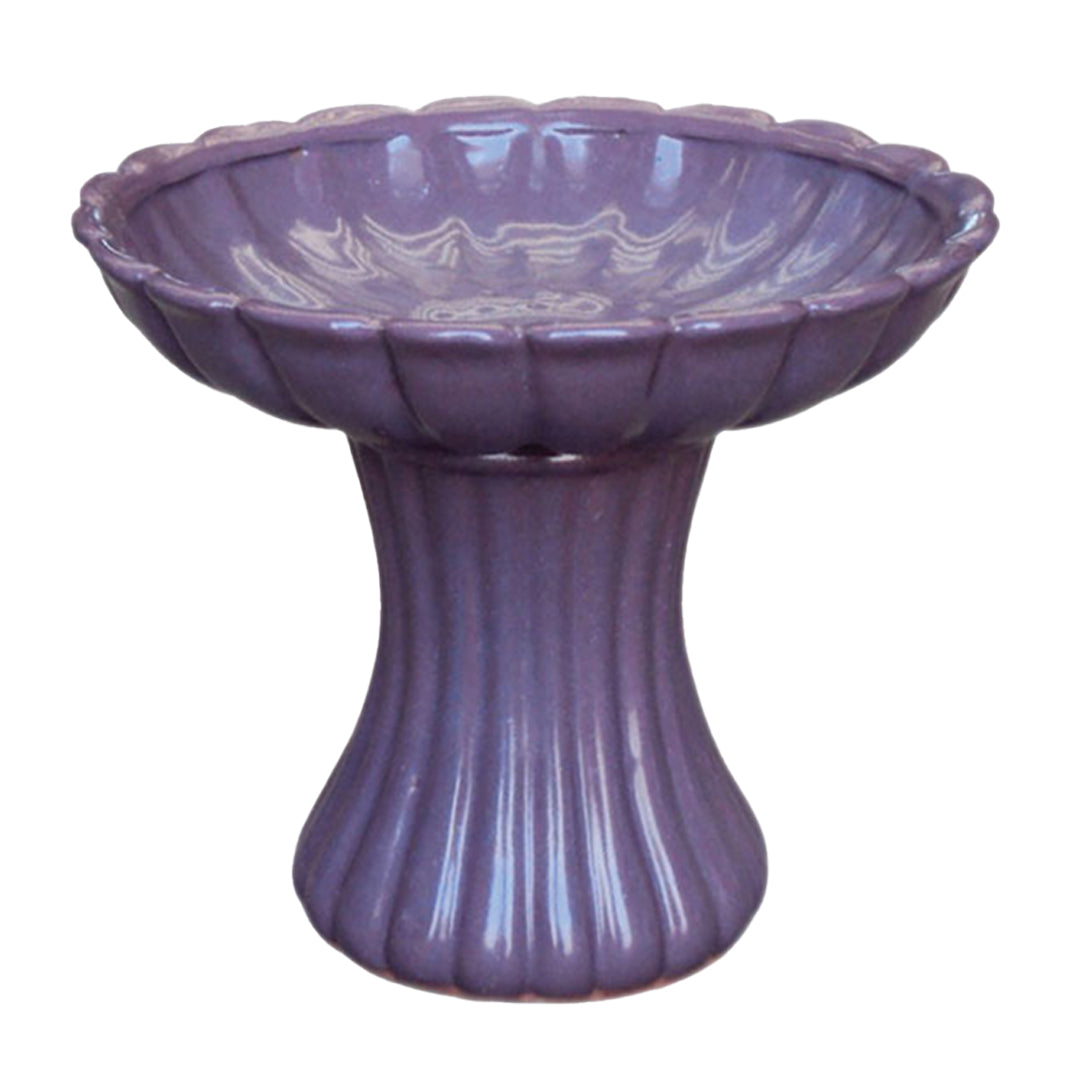 Elegant ceramic bird bath with pedestal design for attracting birds